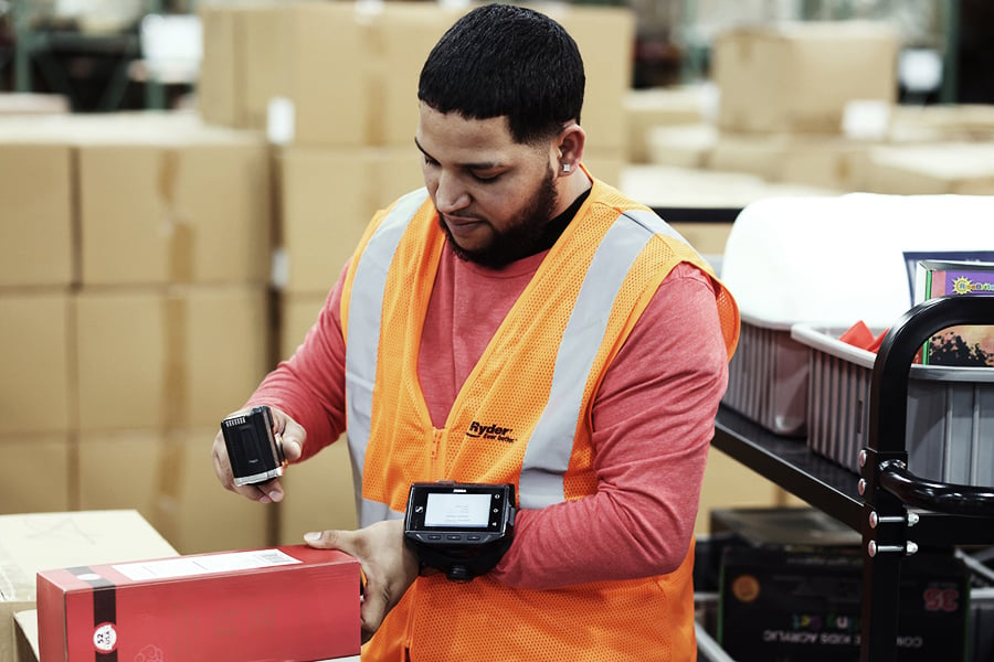 Employee scanning barcodes at a retail fulfillment center