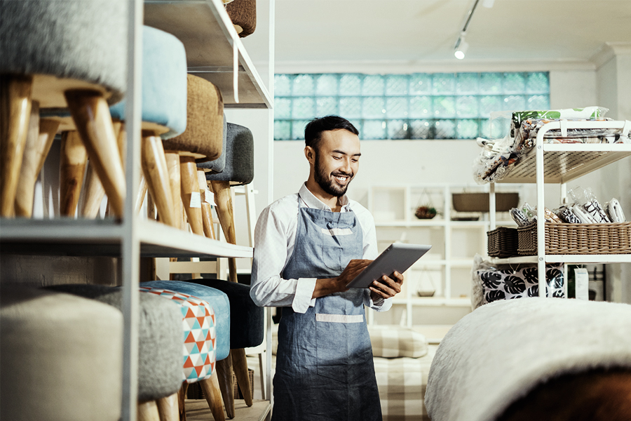 Furniture shop owner checking his inventory