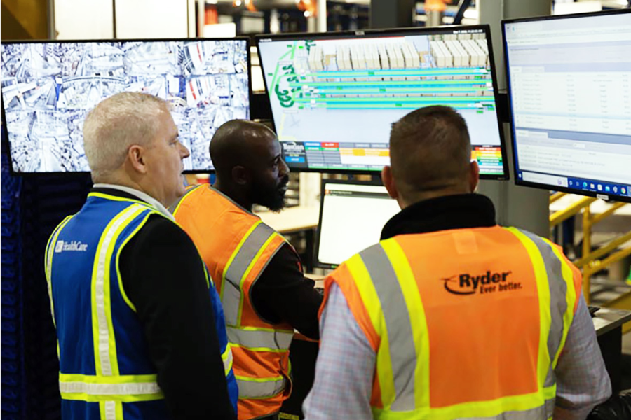 employees looking at computers with fulillment technology